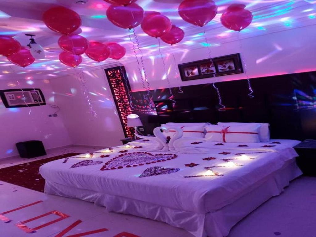 Postel nebo postele na pokoji v ubytování فندق السلطان ان Alsultan Inn Hotel