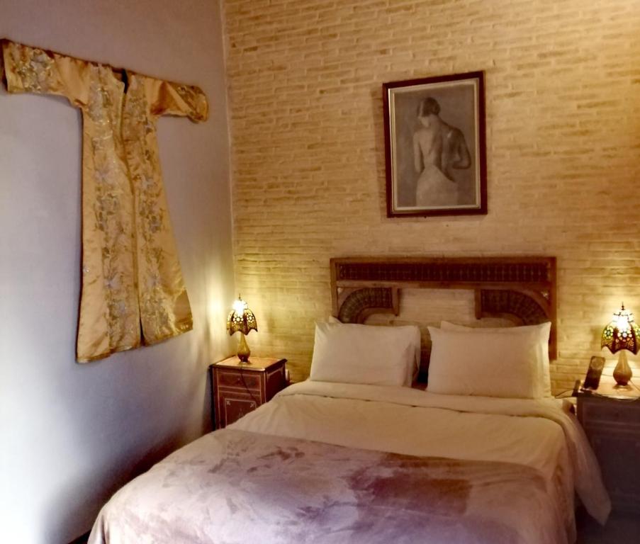 Postel nebo postele na pokoji v ubytování Les Bains de Fez Tara