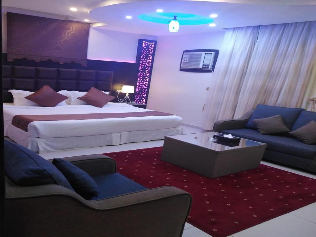 Postel nebo postele na pokoji v ubytování فندق السلطان ان Alsultan Inn Hotel