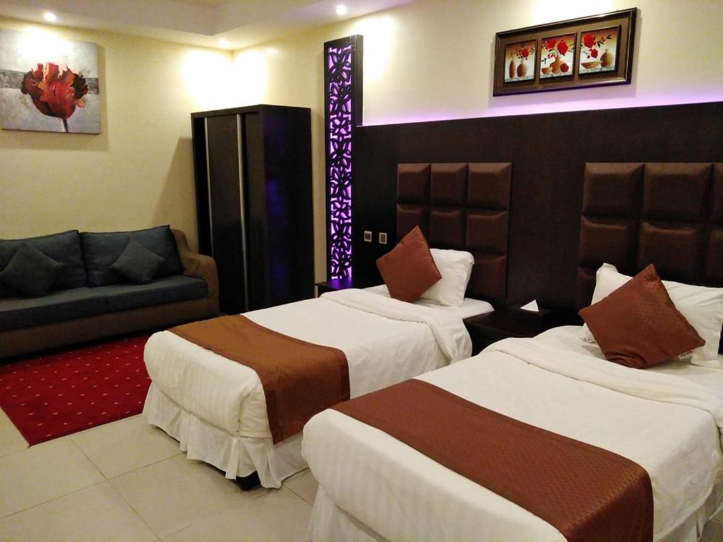 Postel nebo postele na pokoji v ubytování فندق السلطان ان Alsultan Inn Hotel