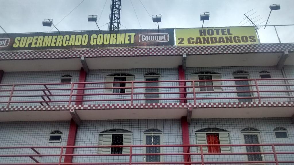 a building with a sign on top of it at Hotel Dois Candangos in Brasília