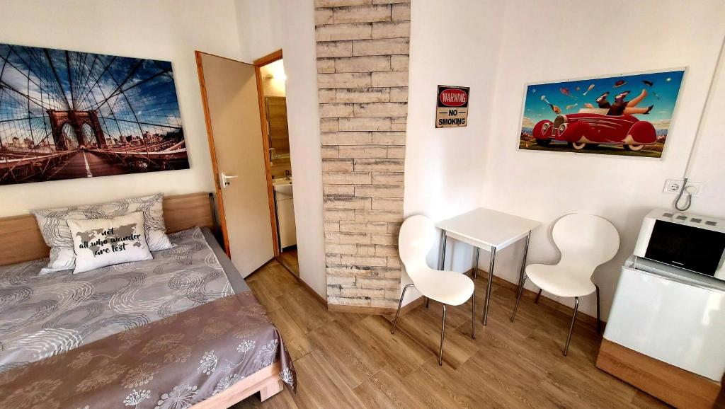 Postel nebo postele na pokoji v ubytování MP Center Magánszállás
