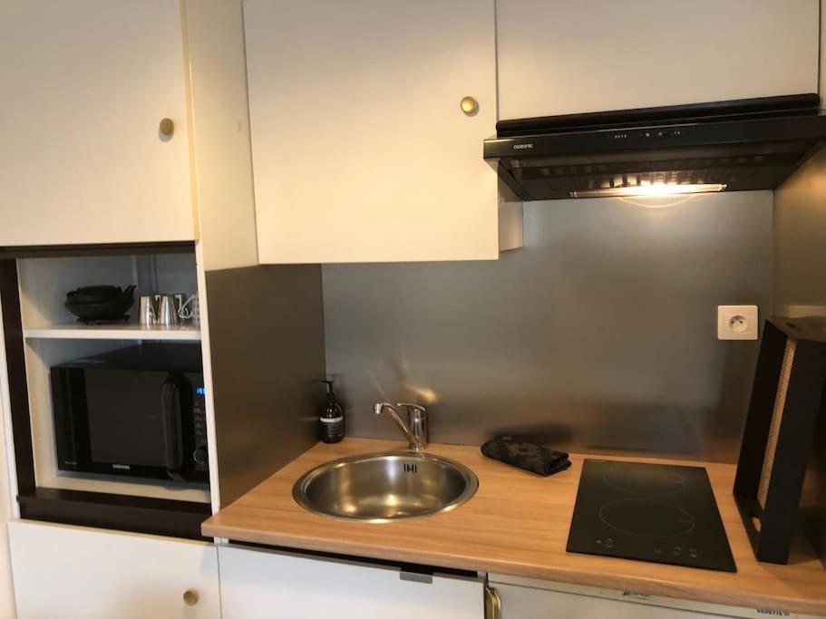 Kuchyňa alebo kuchynka v ubytovaní Appartement Élégant à 2 Pas de la Mer