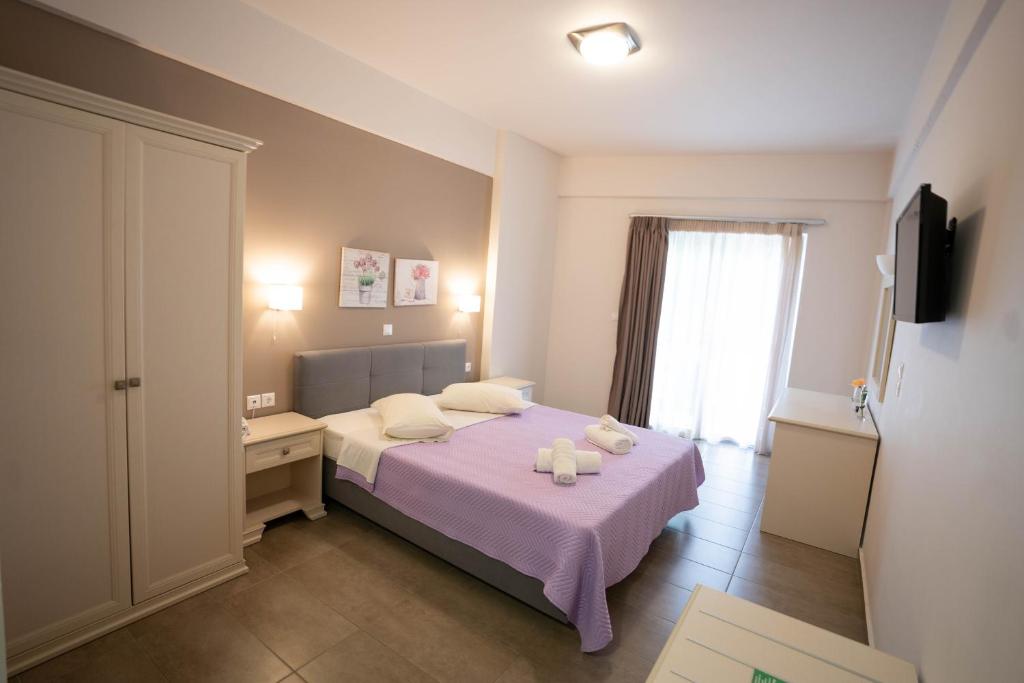 Postel nebo postele na pokoji v ubytování Harmony Hotel