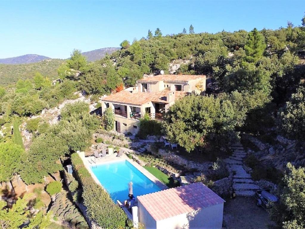 an aerial view of a house with a swimming pool at Villa with private pool in Tourtour in Tourtour