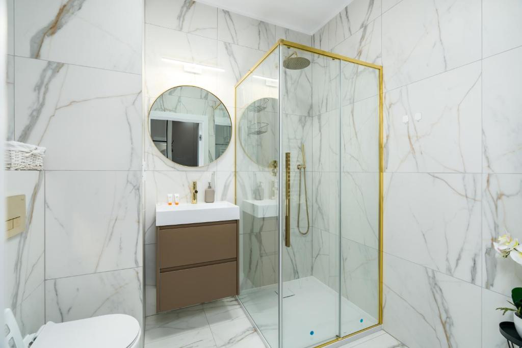 Kúpeľňa v ubytovaní Apartments City View Garbary by Noclegi Renters