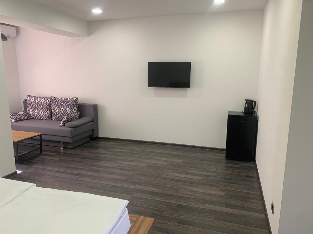 TV a/nebo společenská místnost v ubytování One Day Hotel