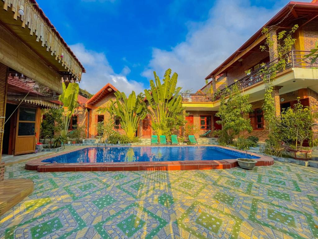 a swimming pool in the courtyard of a house at Cosiana Homestay in Ninh Binh