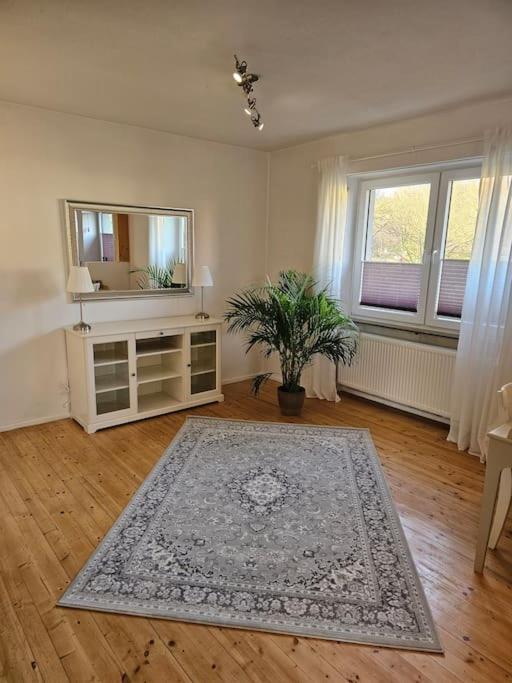 a living room with a mirror and a rug at Große PRIVATE SPA WELLNESS Ferienwohnung in KOBLENZ NÄHE ZUM RHEIN in Koblenz