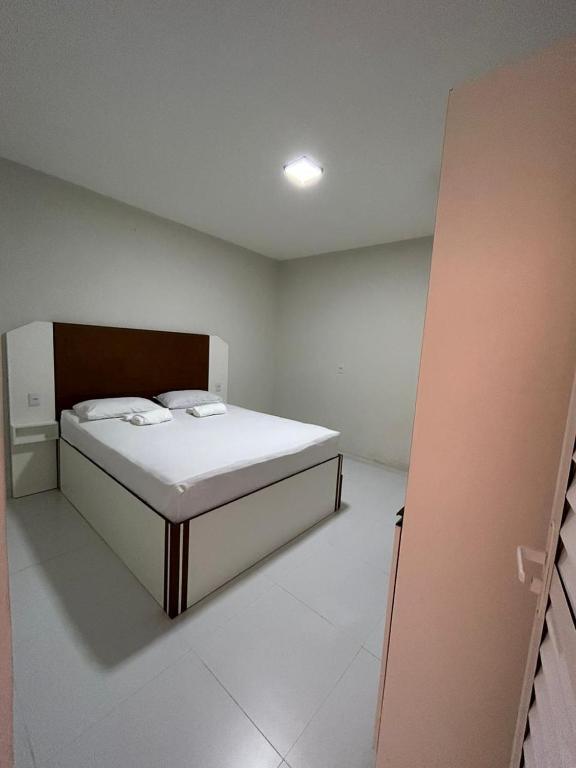 Postel nebo postele na pokoji v ubytování MANERO POUSADA e HOSTEL