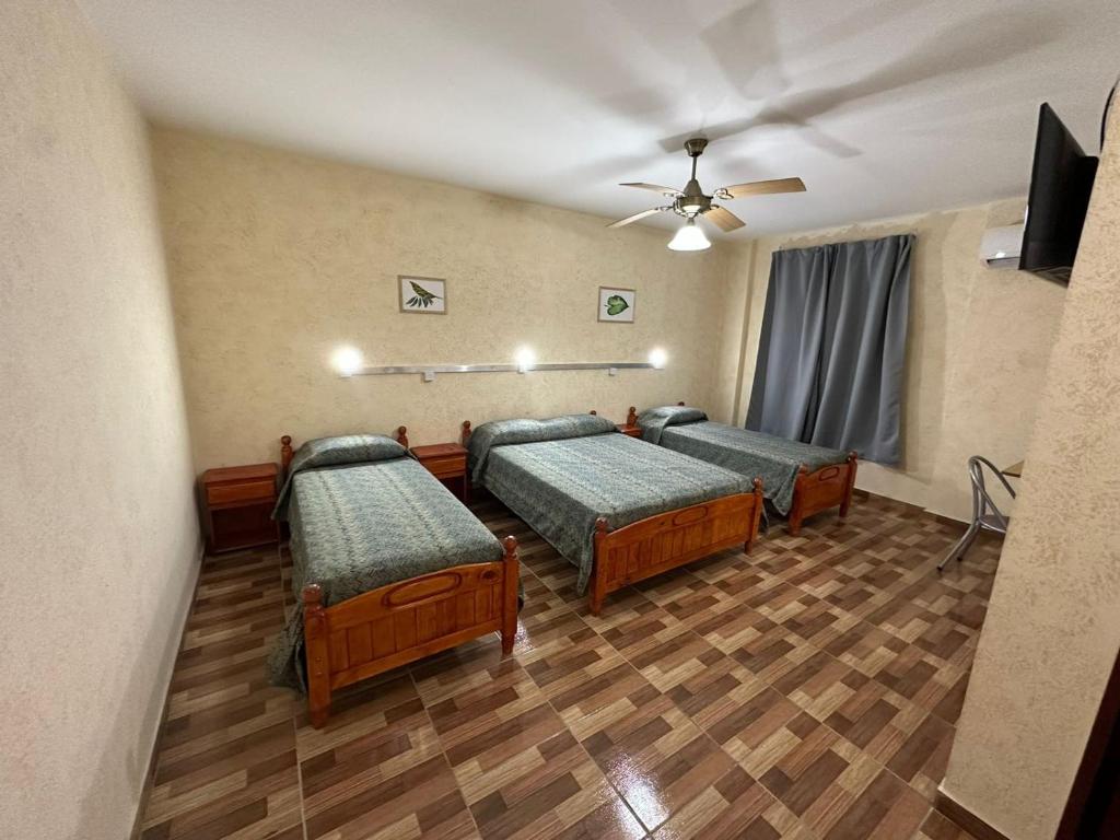 Ένα ή περισσότερα κρεβάτια σε δωμάτιο στο Centro1555