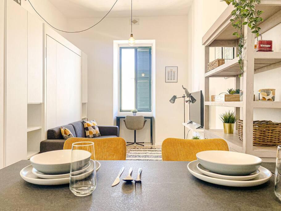 a living room with a table with two plates on it at Entire Studio Apartment in Sliema 2A By Solea in Sliema