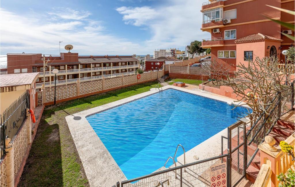 an overhead view of a swimming pool on top of a building at Amazing Apartment In Torremolinos in Torremolinos