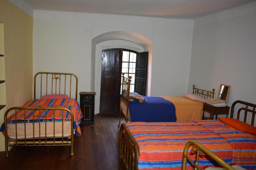 Postel nebo postele na pokoji v ubytování Anata Hostal