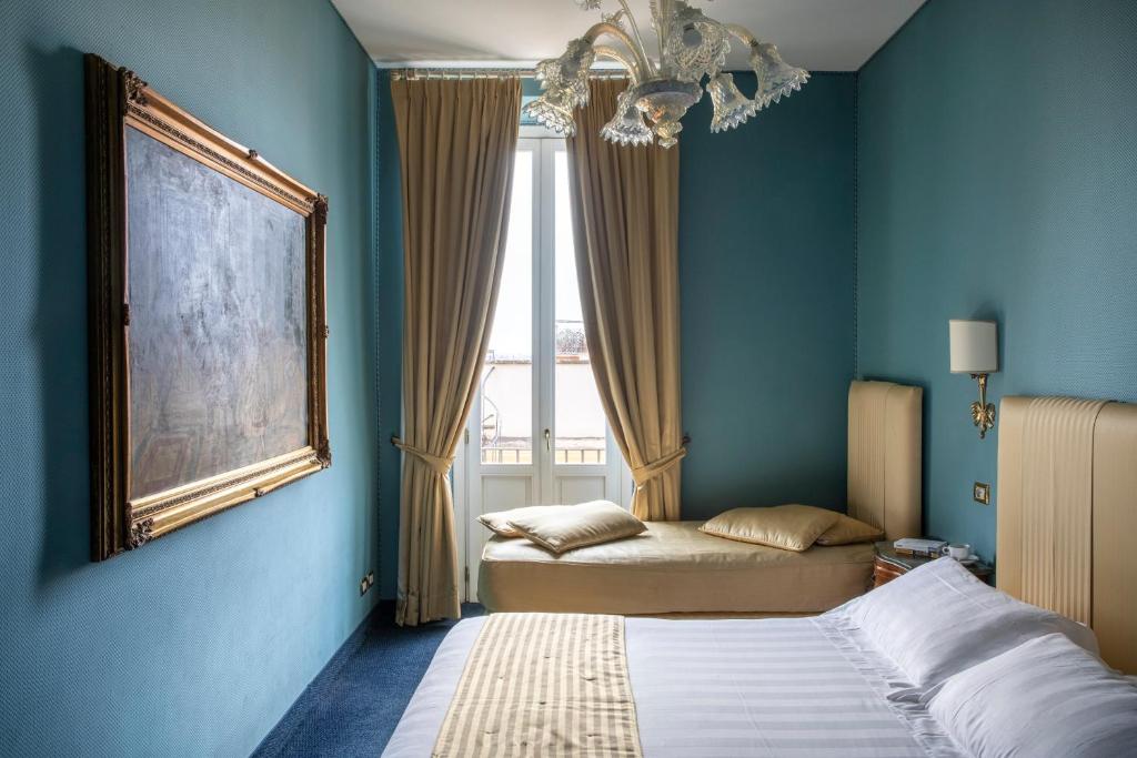 Postel nebo postele na pokoji v ubytování Hotel Scalinata Di Spagna