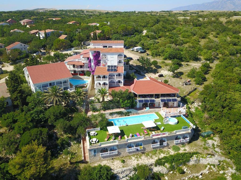an aerial view of a house with a swimming pool at Garden Resort - Apartments Maslina in Potocnica