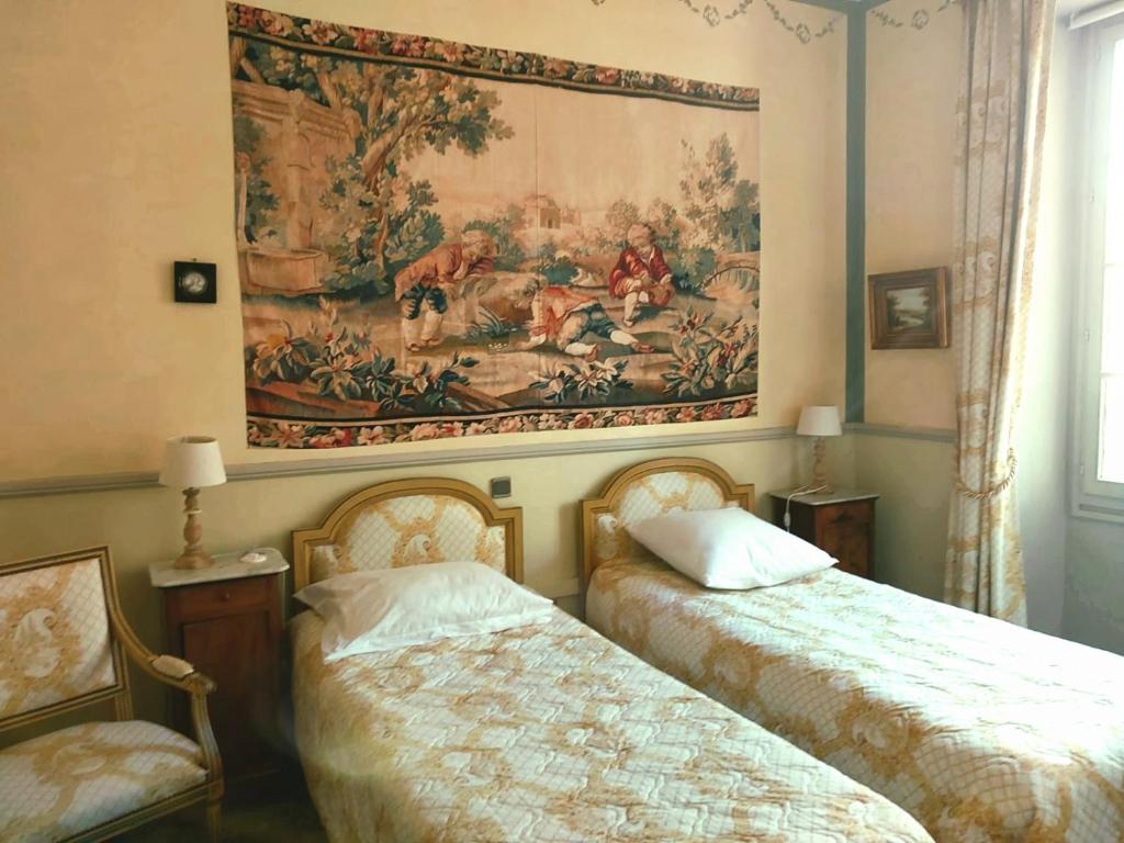 Postel nebo postele na pokoji v ubytování Le Parc château Gipieres