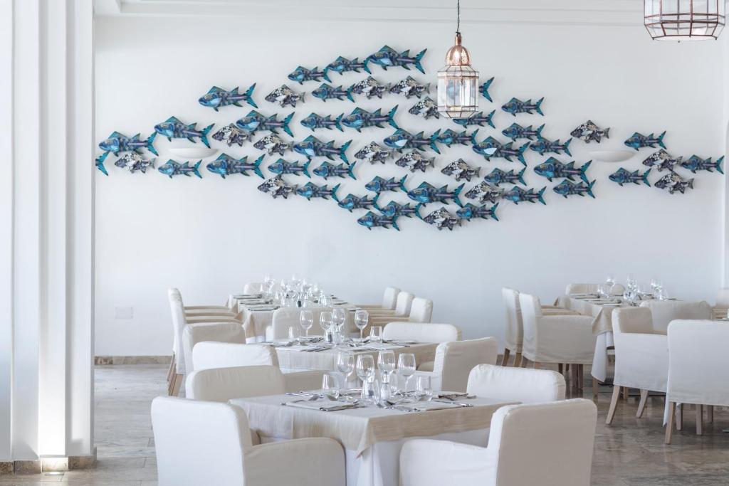 A seating area at Falkensteiner Resort Capo Boi