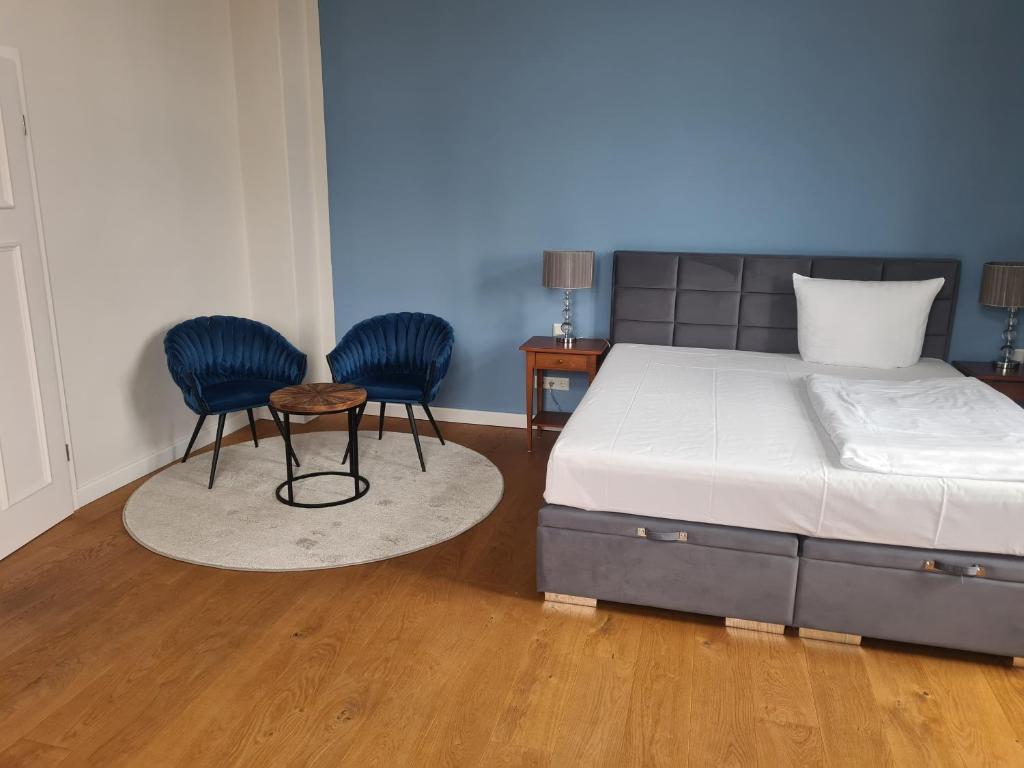 Postel nebo postele na pokoji v ubytování Hotel Villa Viktoria Luise