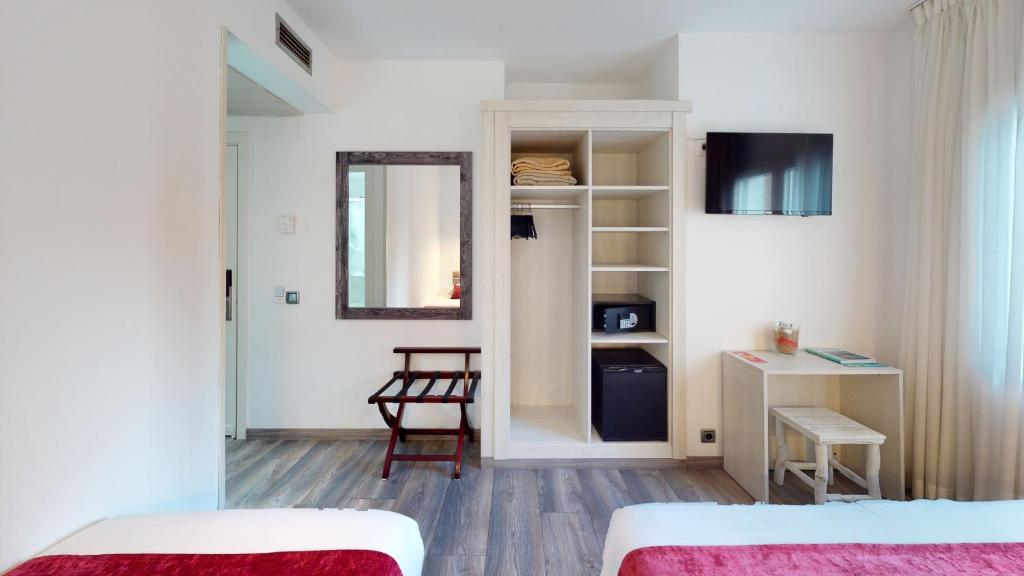 Posteľ alebo postele v izbe v ubytovaní Hotel Bella Dolores