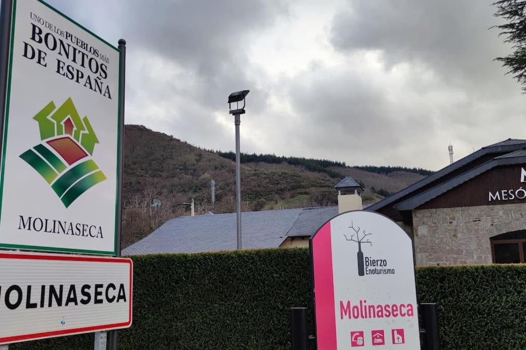 a couple of signs in front of a building at BenedettaMolinaseca VuT in Molinaseca