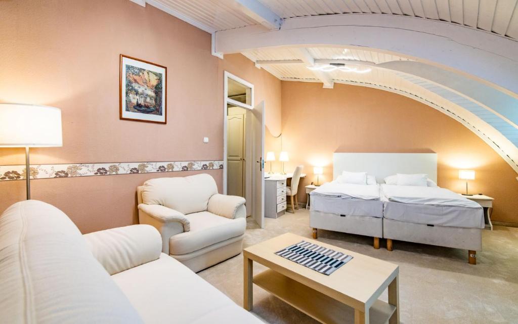 Postel nebo postele na pokoji v ubytování Hotel Jogar