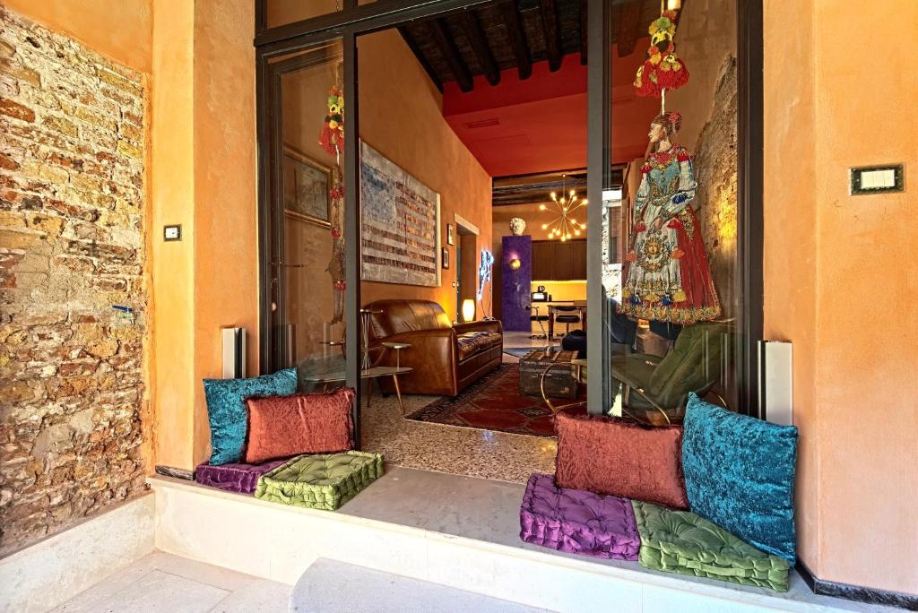 a store front with colorful pillows in a room at Ca' Ranieri Tenti in Venice