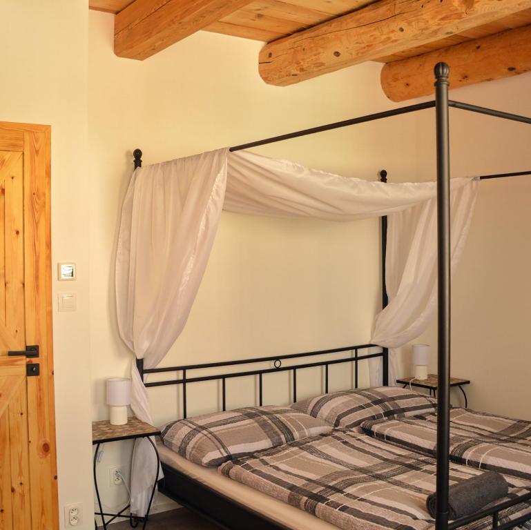 Postel nebo postele na pokoji v ubytování Rezidence Valcha