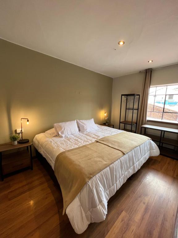 Postel nebo postele na pokoji v ubytování Hostal María Angola