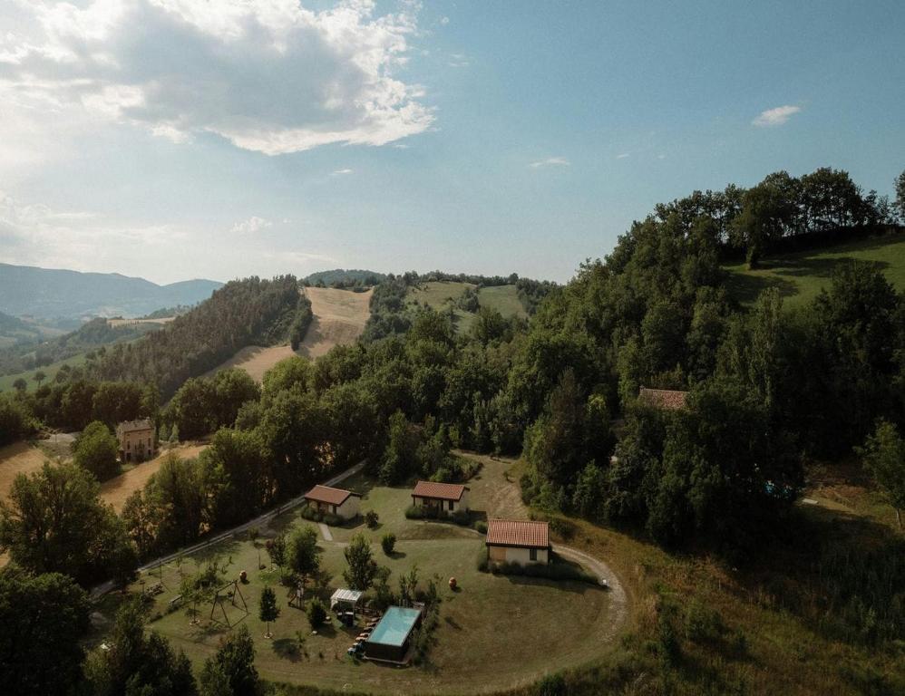 an aerial view of a farm with houses and trees at Valle del Lupo in San Ginesio