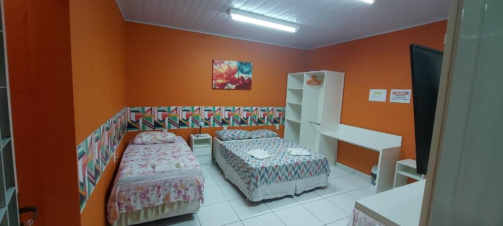 Postel nebo postele na pokoji v ubytování Hotel Colors Manaus