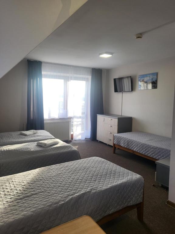 Postel nebo postele na pokoji v ubytování Gościniec Pieniński