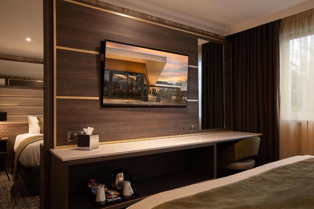 Postel nebo postele na pokoji v ubytování Carlton Hotel