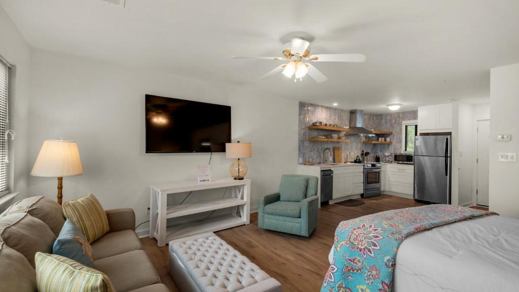 a living room with a bed and a kitchen at Hidden Beach 219 in Santa Rosa Beach