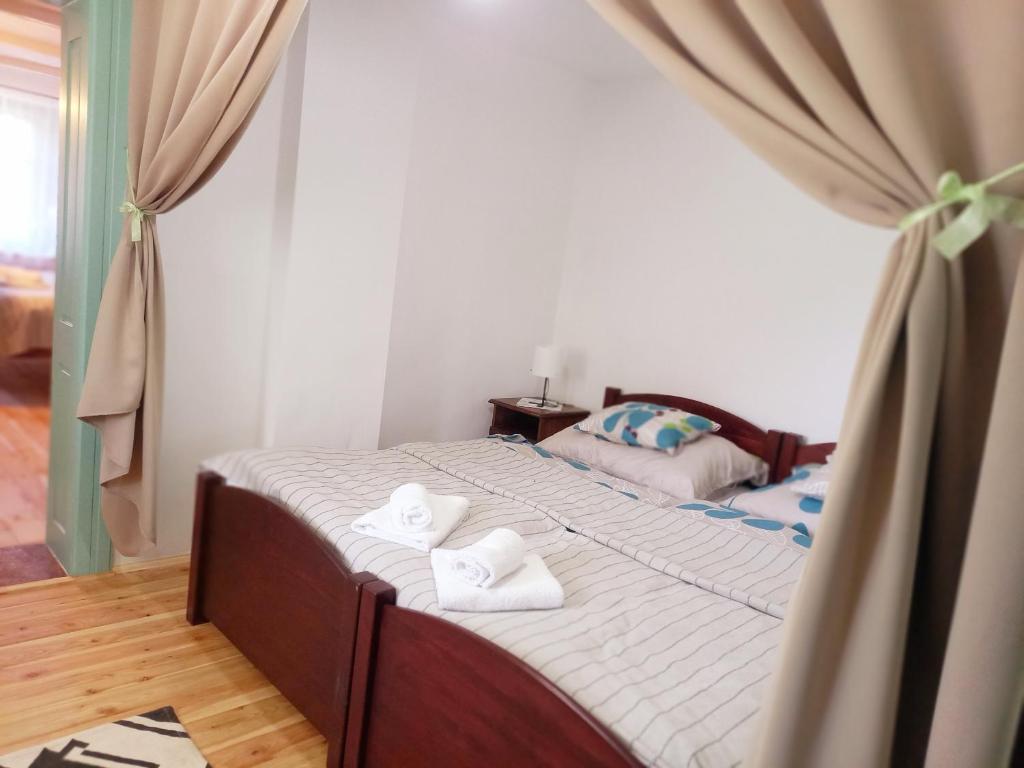 Postel nebo postele na pokoji v ubytování Idill Cottage Vendégház