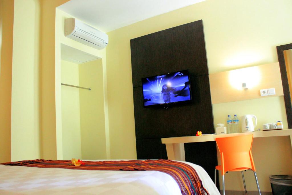 Postel nebo postele na pokoji v ubytování M Hotel