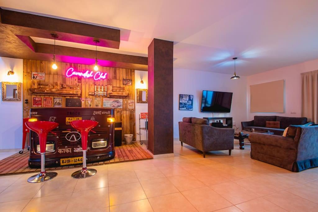 A seating area at Villa Cavendish with sea views and heatable pool close to Flamingo Beach