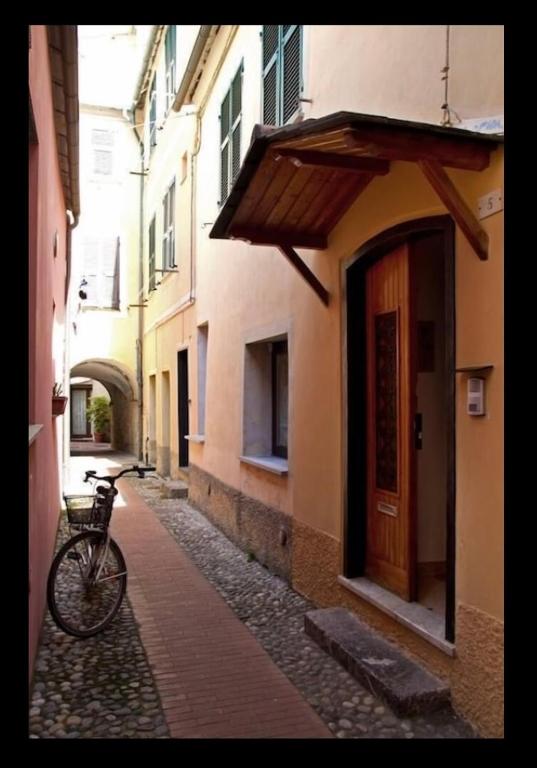 a bike parked on a street in an alley at Casa Gelsomino in Levanto
