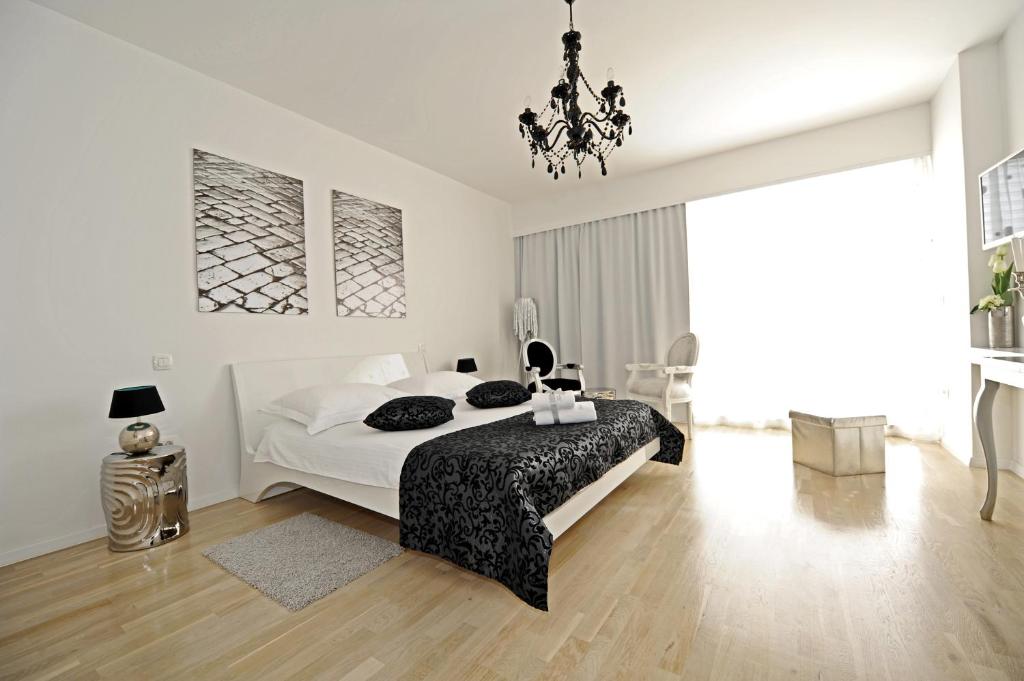 Posteľ alebo postele v izbe v ubytovaní Tinel Superior Residence