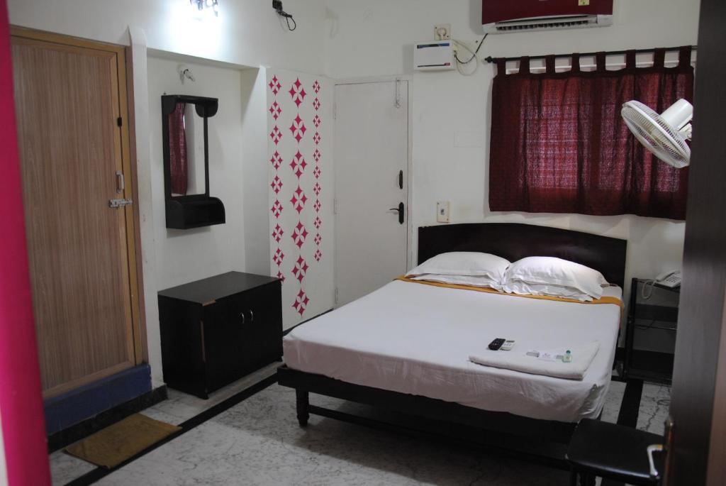 Postel nebo postele na pokoji v ubytování Just Guest House, Chennai Airport