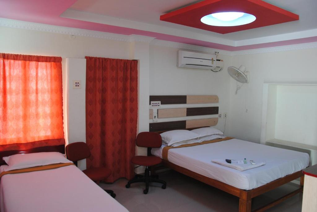 Postel nebo postele na pokoji v ubytování Just Guest House, Chennai Airport