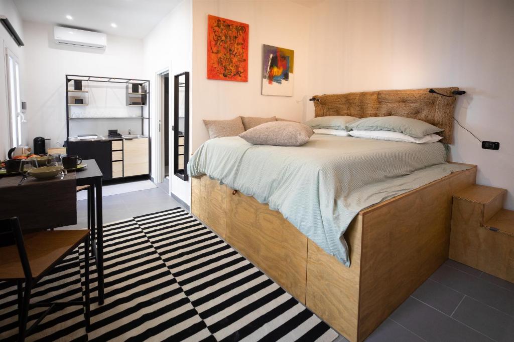 Кровать или кровати в номере Calefati up