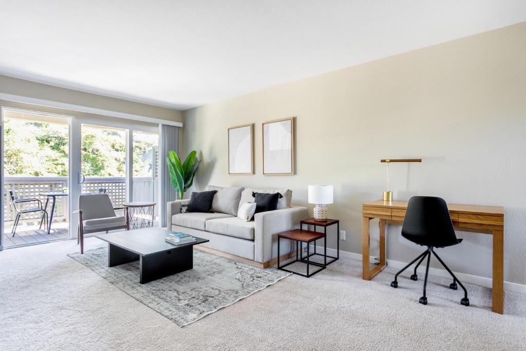 a living room with a couch and a table at Cupertino 1BR w Pool Gym AC nr shops SFO-371 in Cupertino