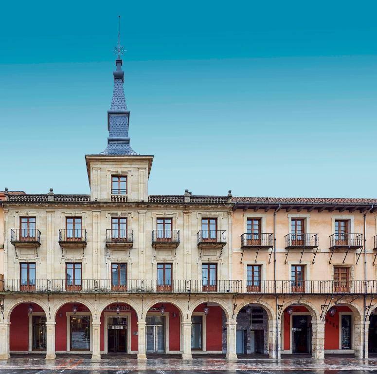 an old building with a tower on top of it at NH Collection León Plaza Mayor in León