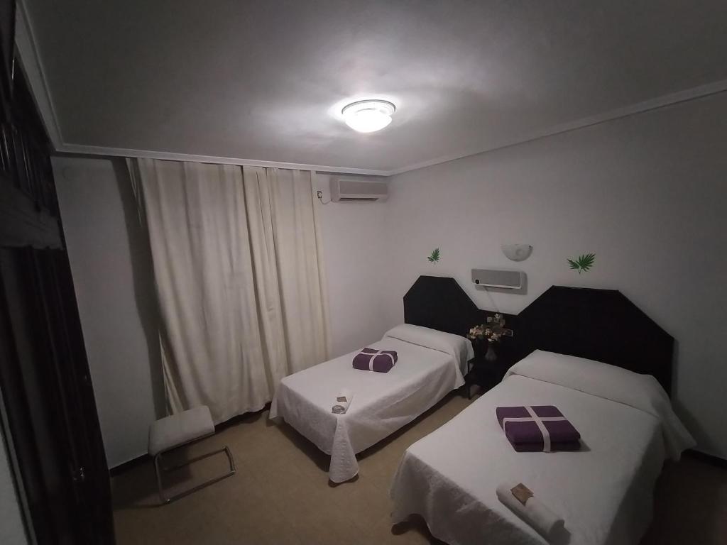 Postel nebo postele na pokoji v ubytování Hostal New York City