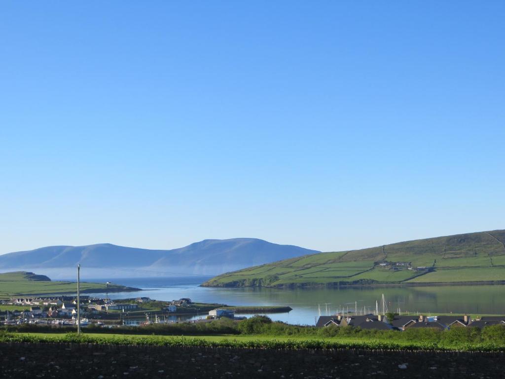 a view of a lake with mountains in the background at The Lighthouse in Dingle