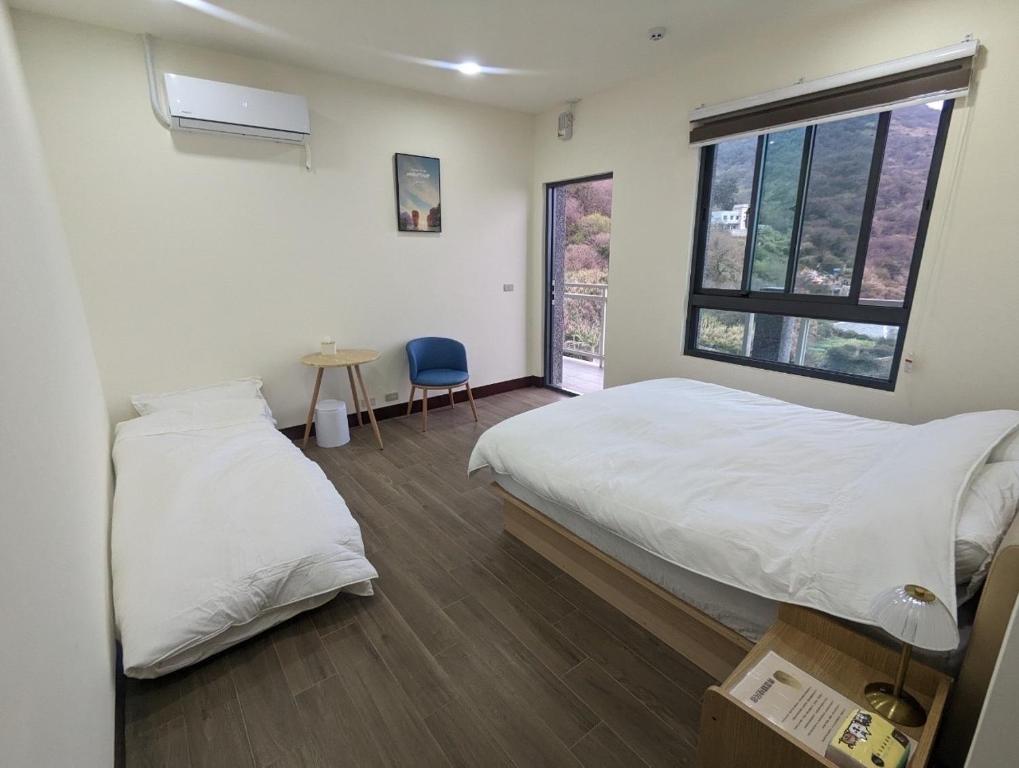 Кровать или кровати в номере 青雲驛棧