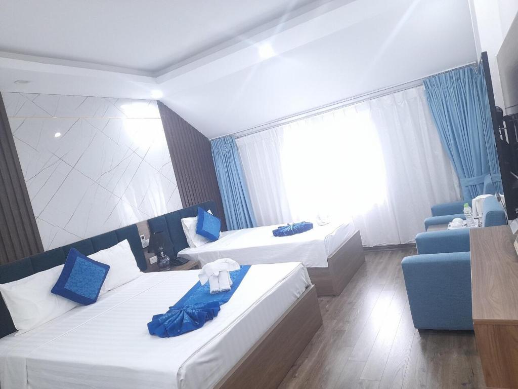Postel nebo postele na pokoji v ubytování Aquarius Grand Hotel