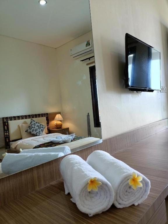 Postel nebo postele na pokoji v ubytování Sapak Bungalow
