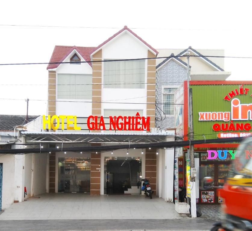 a building with a sign for a gas station at Khách sạn Gia Nghiêm in Ấp Trà Kha